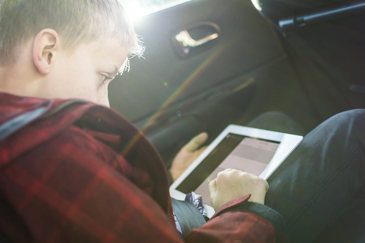 kid playing with tablet