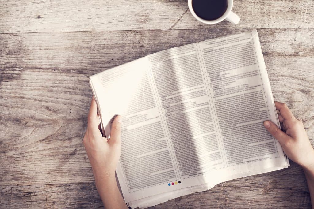 Woman reading a newspaper