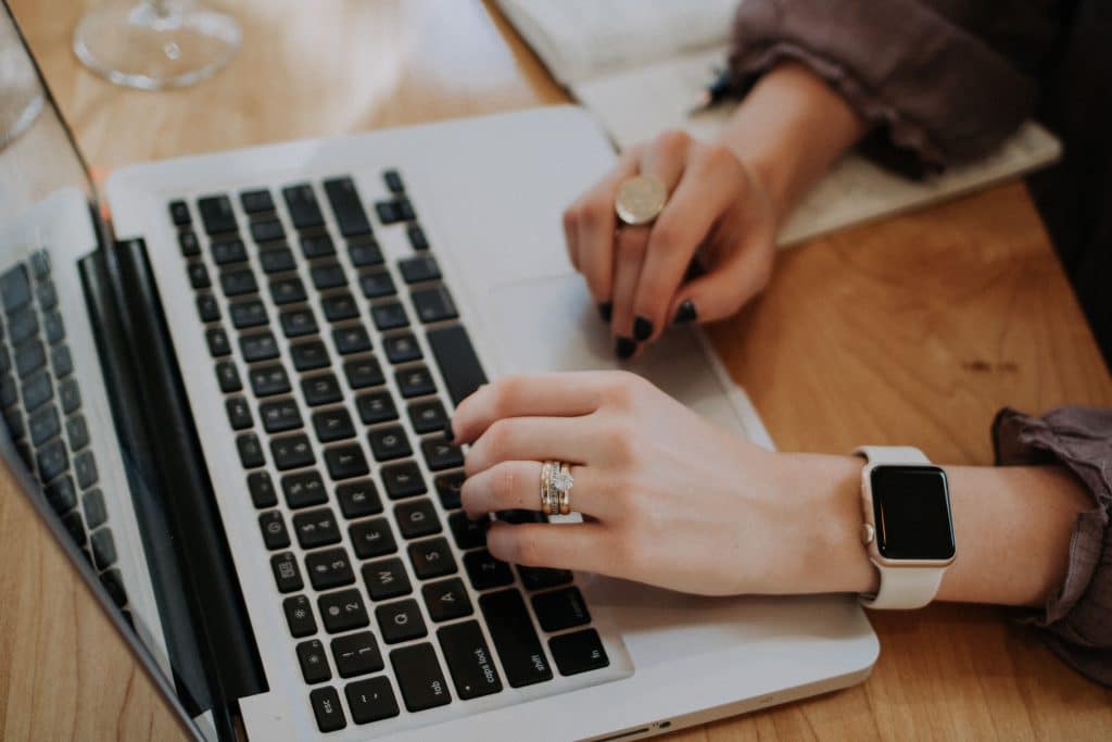 Influencer marketing research on a laptop