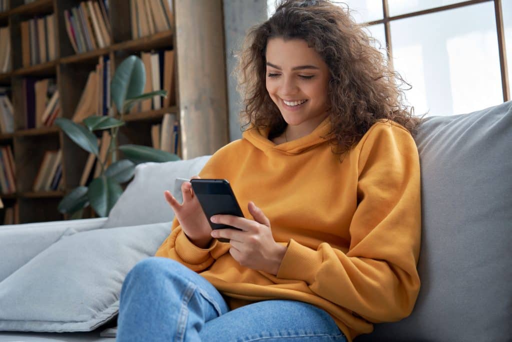 Girl scrolling through phone